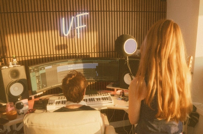 An artist at the mic while the session plays back in the Spaceship